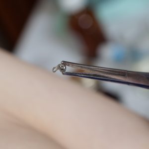 Dermal piercing removal with medical instrument